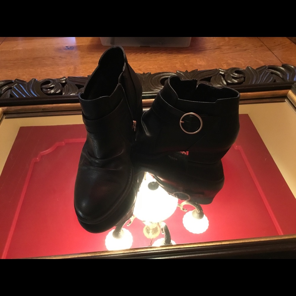 Ankle zipper boots.